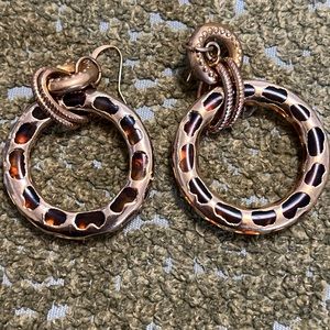 Earrings gold tone. Weight not heavy very easy to wear.